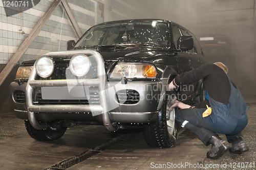 Image of manual car washing