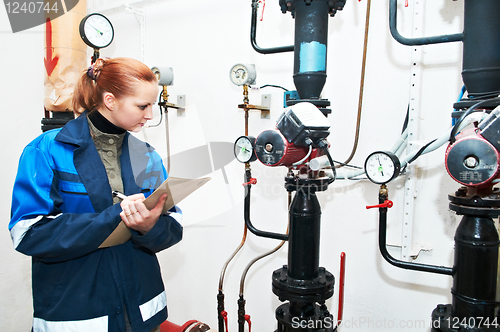 Image of heating engineer in boiler room