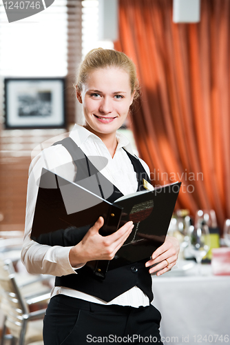 Image of restaurant manager woman at work place