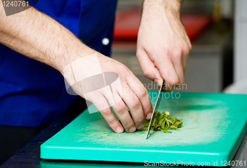 Image of cutting greens on board