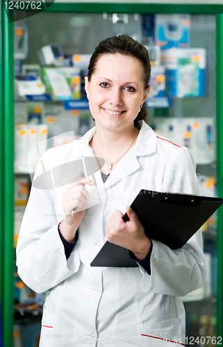 Image of Pharmacy chemist woman in drugstore