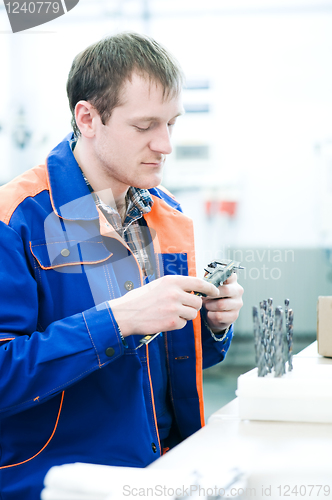 Image of worker measuring detail