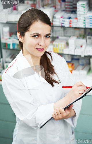 Image of Pharmacy chemist woman in drugstore