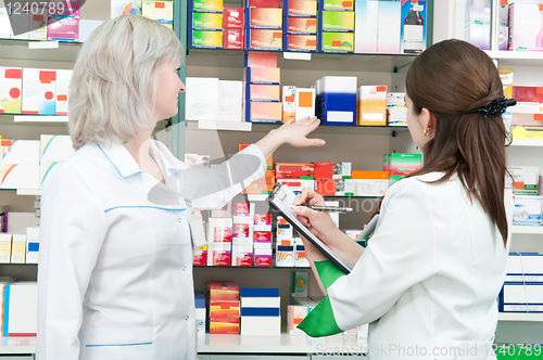 Image of Pharmacy chemist women in drugstore