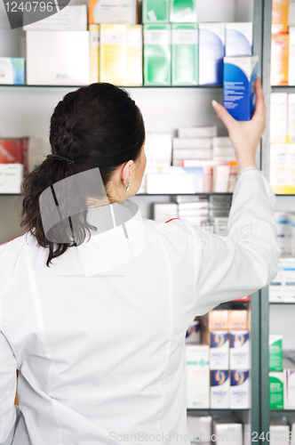 Image of Pharmacy chemist woman in drugstore