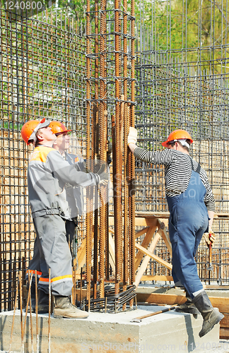 Image of construction workers making reinforcement