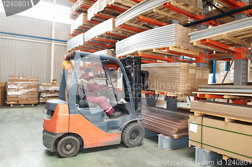 Image of warehouse forklift loader worker