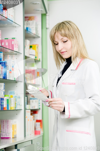 Image of Pharmacy chemist woman in drugstore