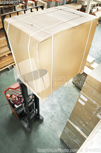 Image of warehouse stacker at work