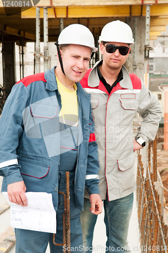 Image of Engineers builders at construction site