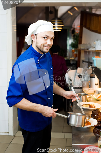 Image of chef with scoop