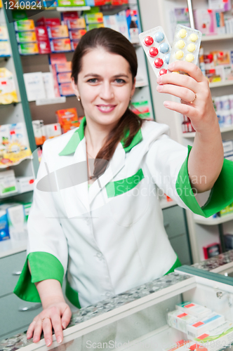 Image of cheerful pharmacist chemist woman