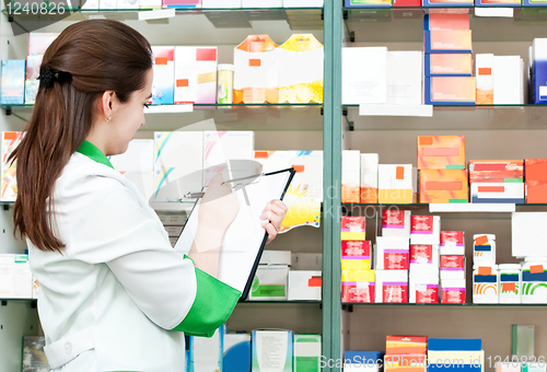 Image of Pharmacy chemist woman in drugstore
