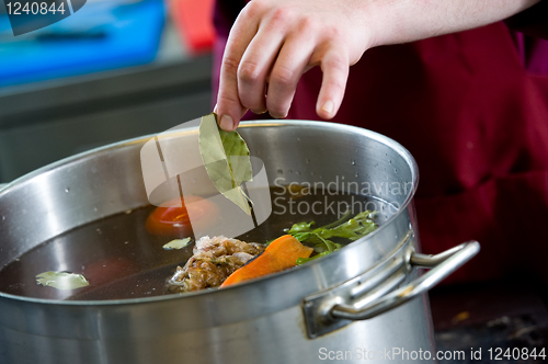 Image of cooking a soup in pot