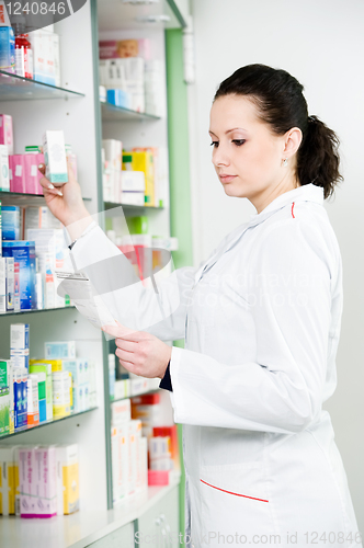 Image of Pharmacy chemist woman in drugstore