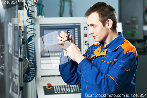 Image of worker examining detail