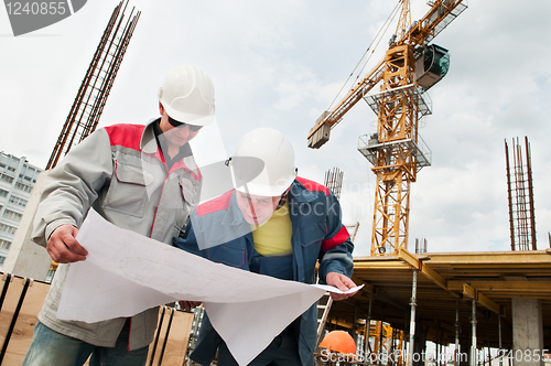 Image of Engineers builders at construction site