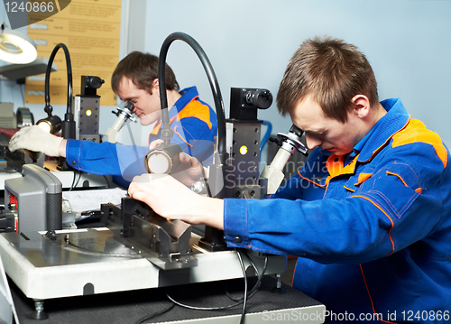Image of two workers at tool workshop