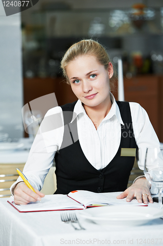 Image of restaurant manager woman at work place