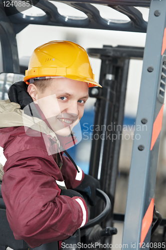 Image of warehouse worker driver in  forklift