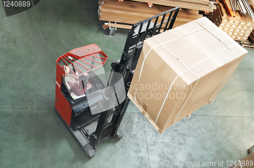 Image of warehouse stacker at work