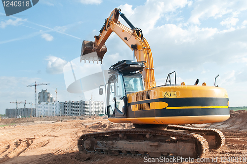 Image of track-type loader excavator at construction area