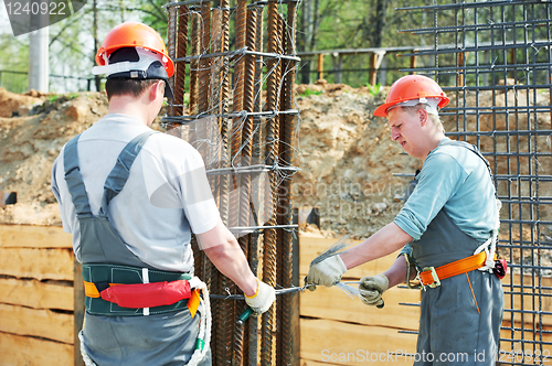 Image of construction workers making reinforcement