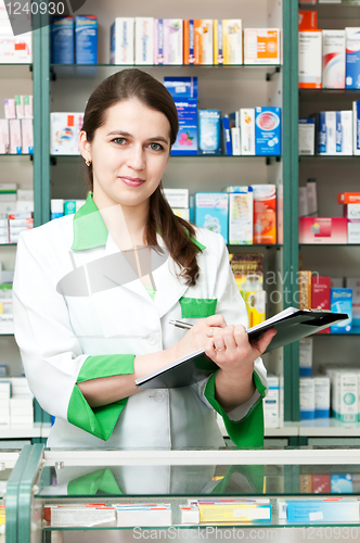 Image of Pharmacy chemist woman in drugstore