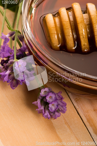 Image of lavender honey with fresh flowers. sweet food 
