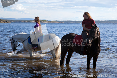 Image of The girls led the horses to water