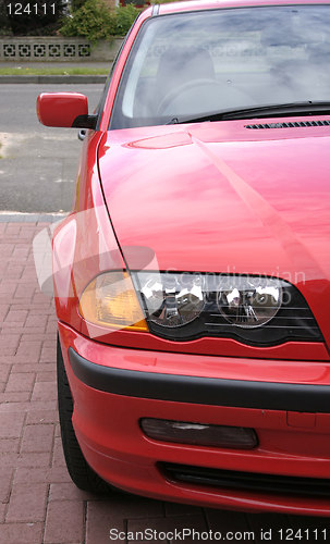 Image of red car wing and headlights