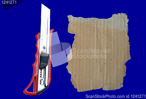 Image of Paper knife and old cardboard