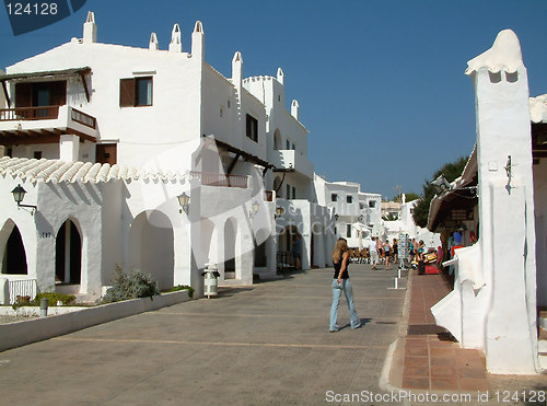 Image of girl walking along a village road