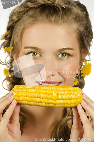 Image of woman eating corn-cob