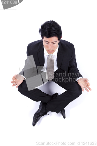 Image of Businessman making yoga