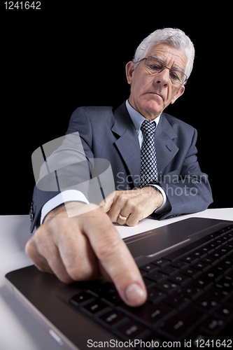 Image of Senior businessman at the office