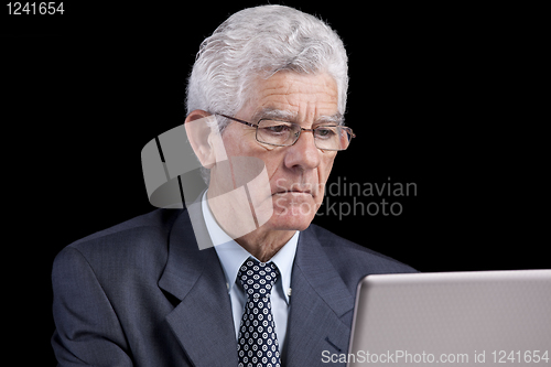 Image of Senior businessman at the office