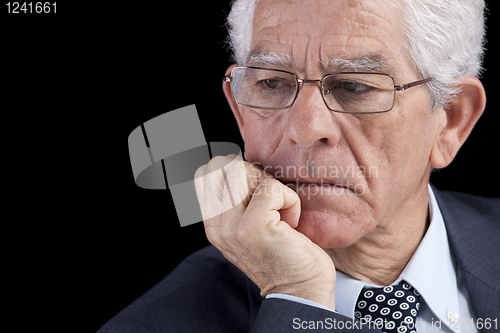 Image of Senior businessman thinking