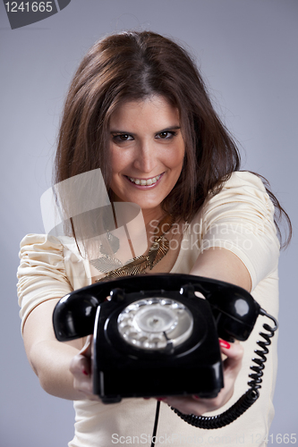 Image of Sexy woman holding a telephone