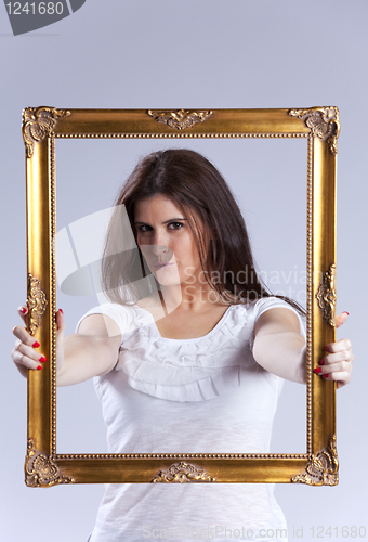 Image of young woman inside a picture frame