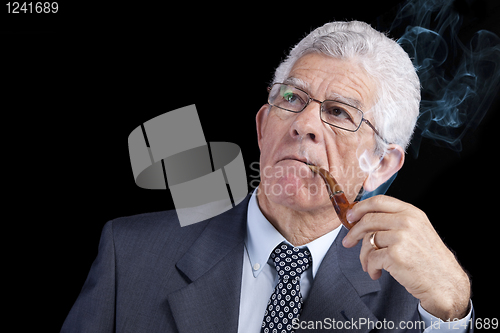 Image of Senior businessman thinking