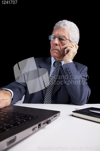 Image of Senior Businessman talking at the cellphone