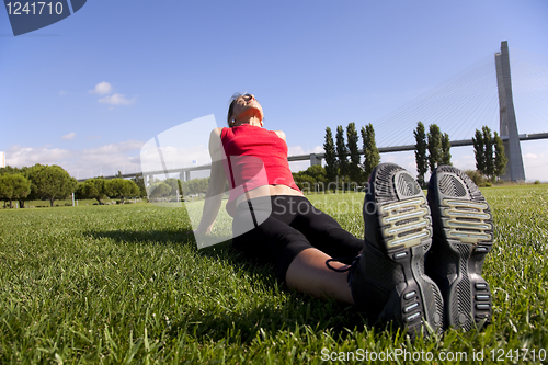 Image of woman doing exercise outdoor