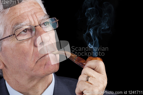 Image of Senior businessman thinking