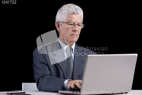 Image of Senior businessman at the office