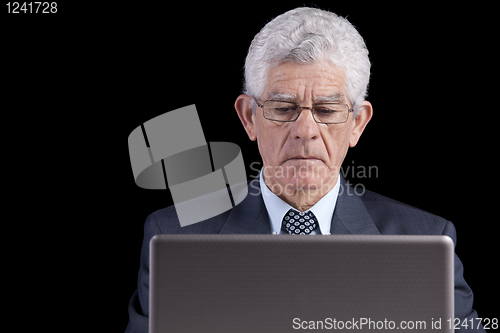 Image of Senior businessman at the office