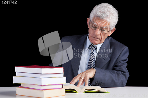 Image of Senior teacher reading Books
