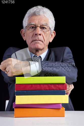 Image of Senior teacher reading Books