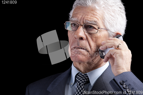 Image of Senior Businessman talking at the cellphone