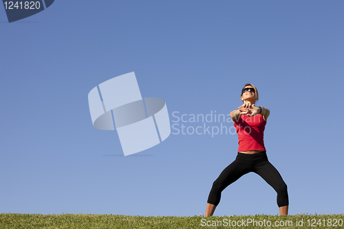 Image of woman doing exercise outdoor